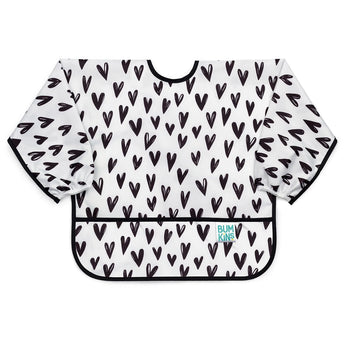 Bumkins Sleeved Bib: Hearts is waterproof with black heart patterns and a crumb catcher pocket.