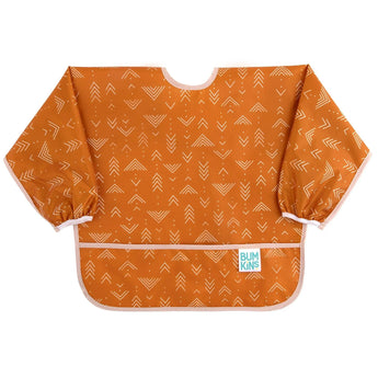 Bumkins Sleeved Bib: Grounded features orange waterproof fabric with white geometric patterns, long sleeves, and a front pocket.