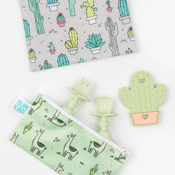 Two pouches feature cactus and llama designs, plus a Bumkins Silicone Teether: Cactus with mint green utensils for teething relief.