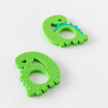 Bumkins Silicone Teether: Dinosaur offers green teethers with blue spikes for gum relief, shown on a white background.
