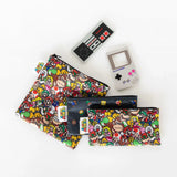 Colorful pouches with Nintendo characters and a Bumkins Silicone Teether shaped like an NES Controller on a Game Boy white background.