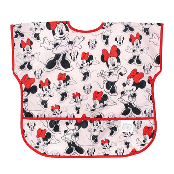The Bumkins Junior Bib: Minnie Mouse Classic is made from lightweight waterproof fabric featuring black and white cartoon mice with red bows.