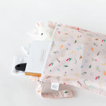 Bumkins Wet Bag: Princess Magic holds a notebook, soft toy, and brush on a white background.