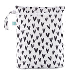 The Bumkins Wet/Dry Bag: Hearts features black heart patterns, is waterproof with a zipper closure and side handle.