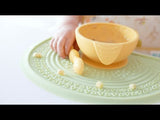Video footage of children using Bumkins Silicone Sensory Placemat with product information.
